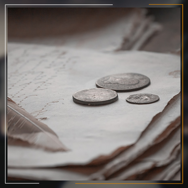 “Miracles Law Group - Three aged coins resting on top of a stack of old, handwritten papers with a blurred background, enclosed within a golden frame.” This image effectively conveys a sense of history and value, highlighting the expertise of Miracles Law Group in handling cases that may involve historical or financial documentation.