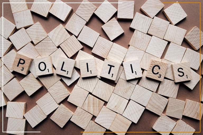 “Miracles Law Group - Scrabble tiles spelling out ‘POLITICS’ on a background of scattered blank wooden tiles.” This image effectively conveys the complexity and intricacies of political matters, highlighting the expertise of Miracles Law Group in navigating such issues.